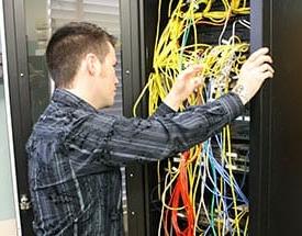 male student with computer wiring